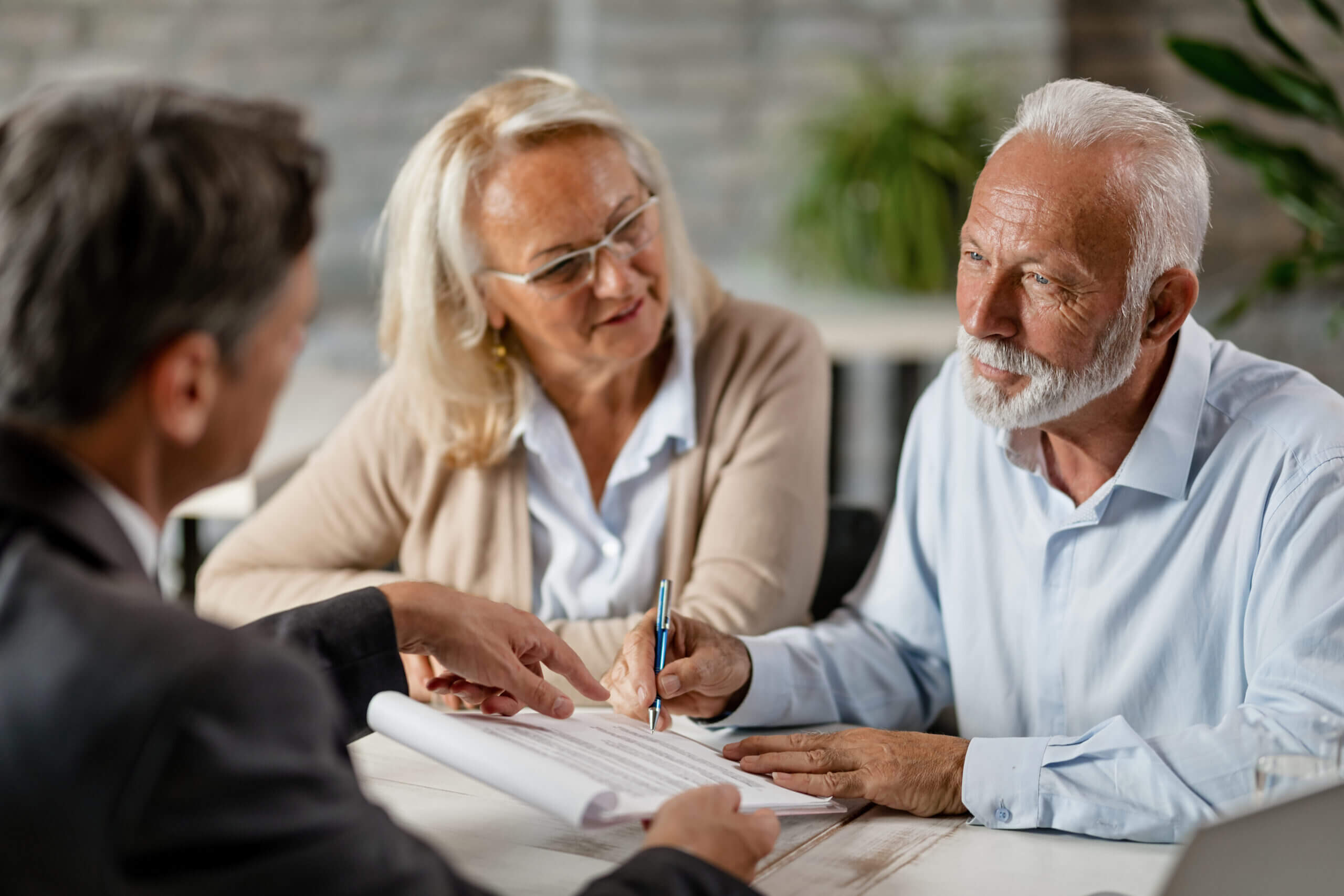 Senior couple signing Revocable living trust